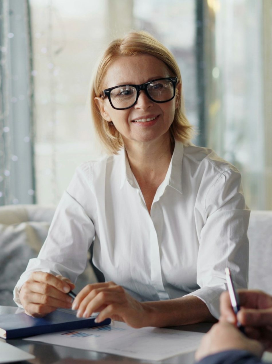 A smiling lawyer meeting with a client